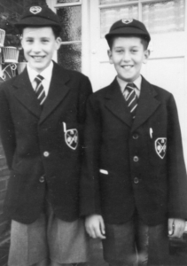 2 boys in their East Barnet School uniform with caps from the1950s history archive.