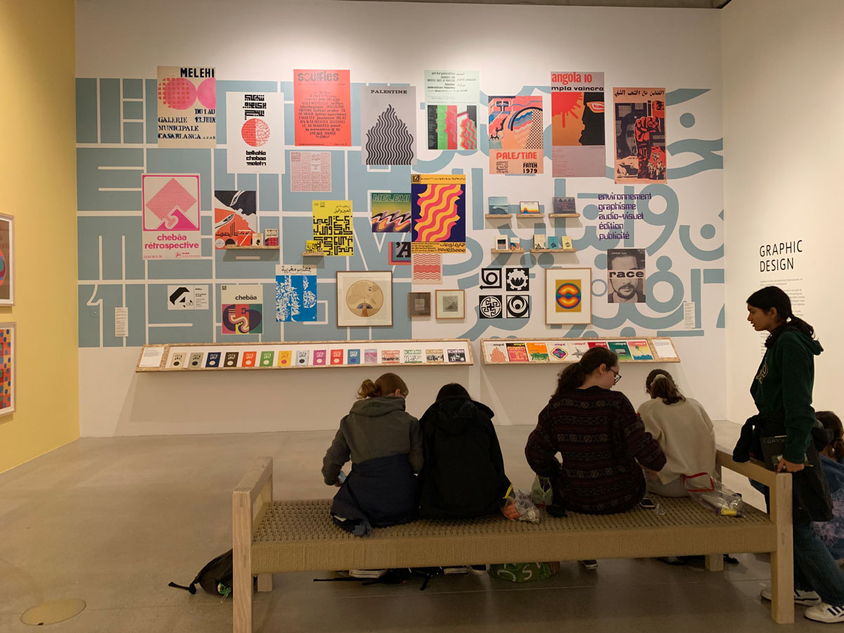 students drawing in a gallery