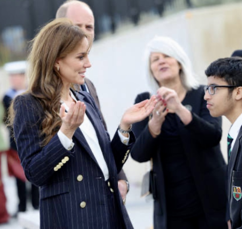 the princess of wales talking to a student