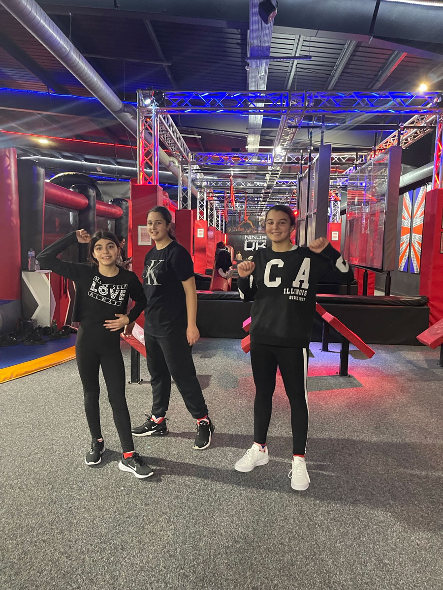 three students getting ready to tackle ninja warrior uk course