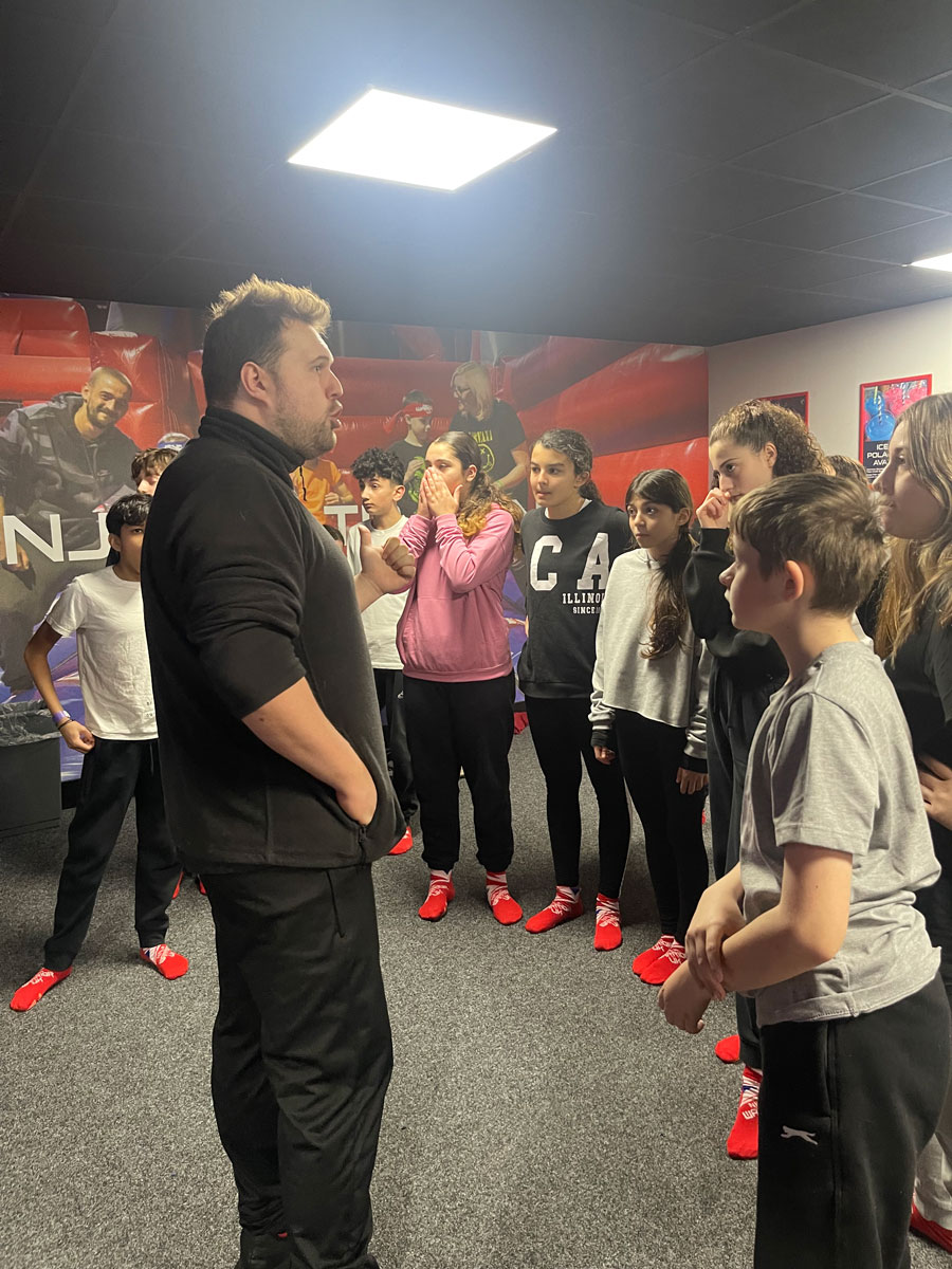students standing around the instructor at ninja warrior uk
