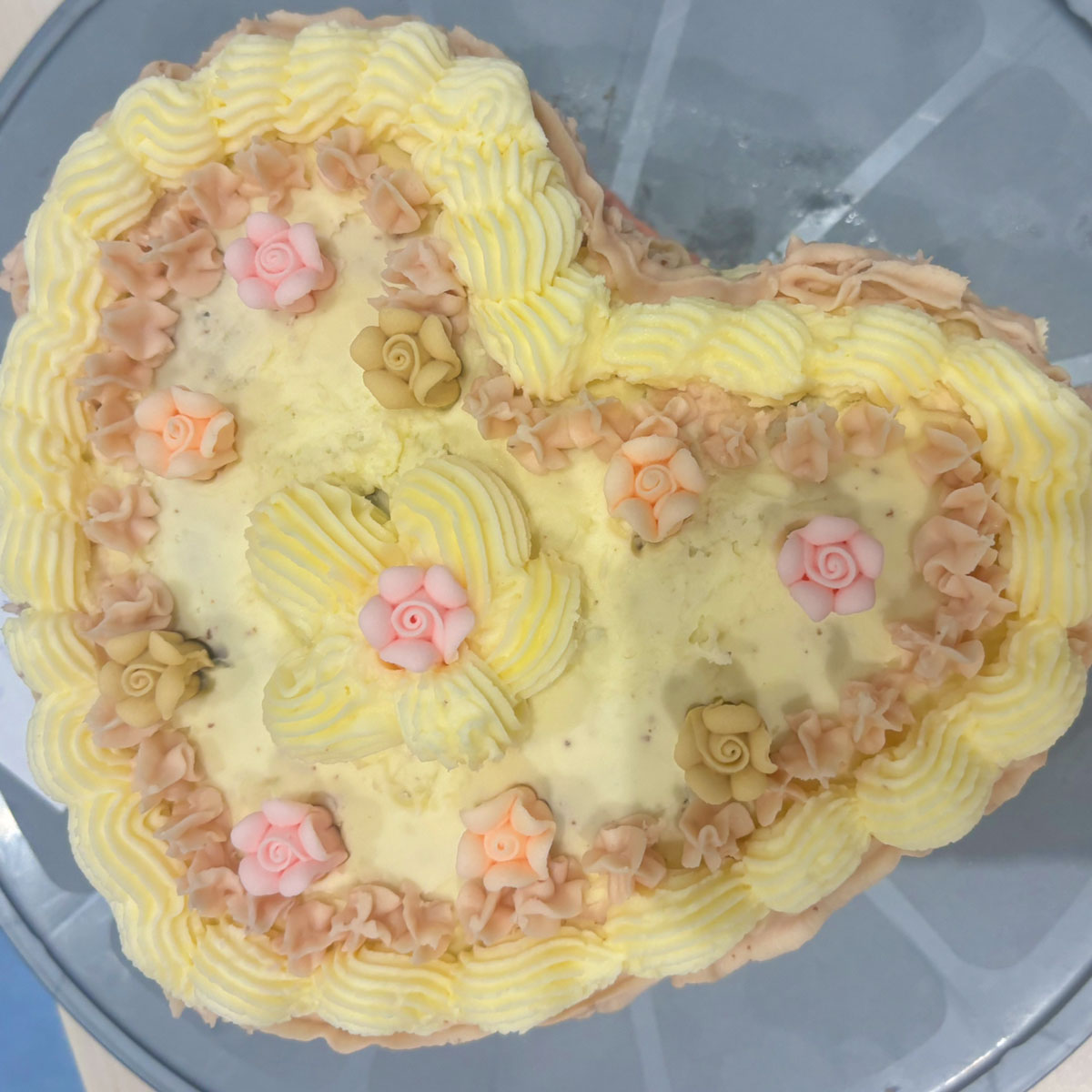 a yellow heart shaped cake for the ebs cake competition