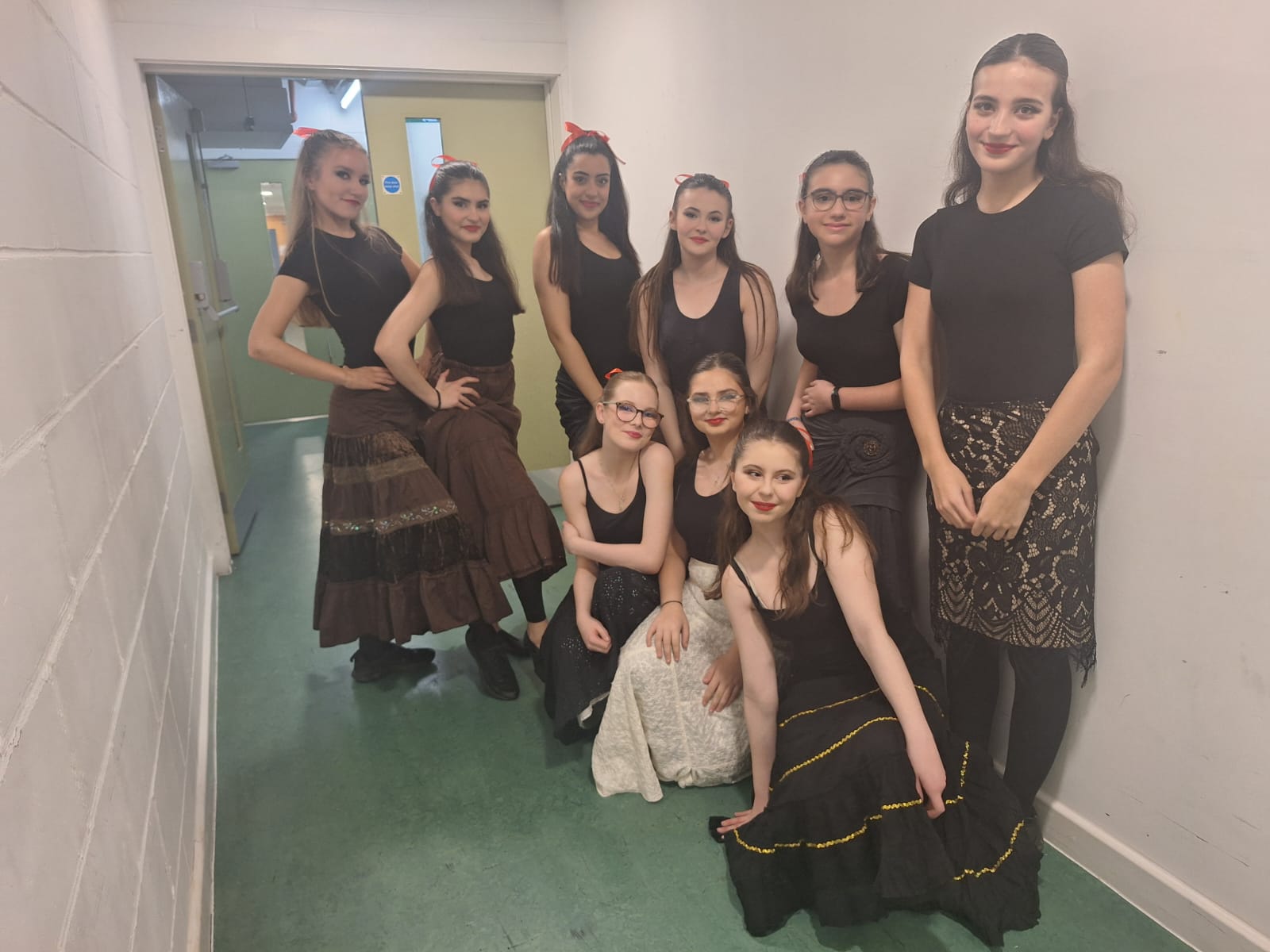 students in their costumes ready to dance at the arts depot