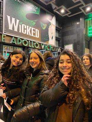 east barnet school students outside the theatre to see wicked