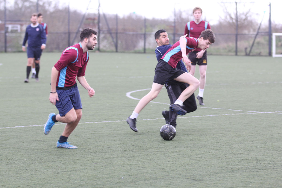a big tackle between the ebs staff and students at the football match