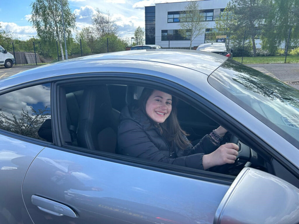 a student in a porsche during a careers talk